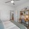 a bedroom with a bed and a fan
