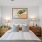 a bedroom with a bed and lamps