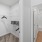 a bathroom with a closet, a shower and toilet