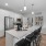 a kitchen with a table and chairs