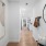 a hallway with a mirror and a couch