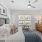 a bedroom with a bed and a fan