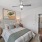 a bedroom with a bed and a desk