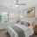 a bedroom with a bed and a chair